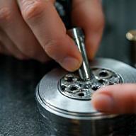 Skilled hands finishing a metal component